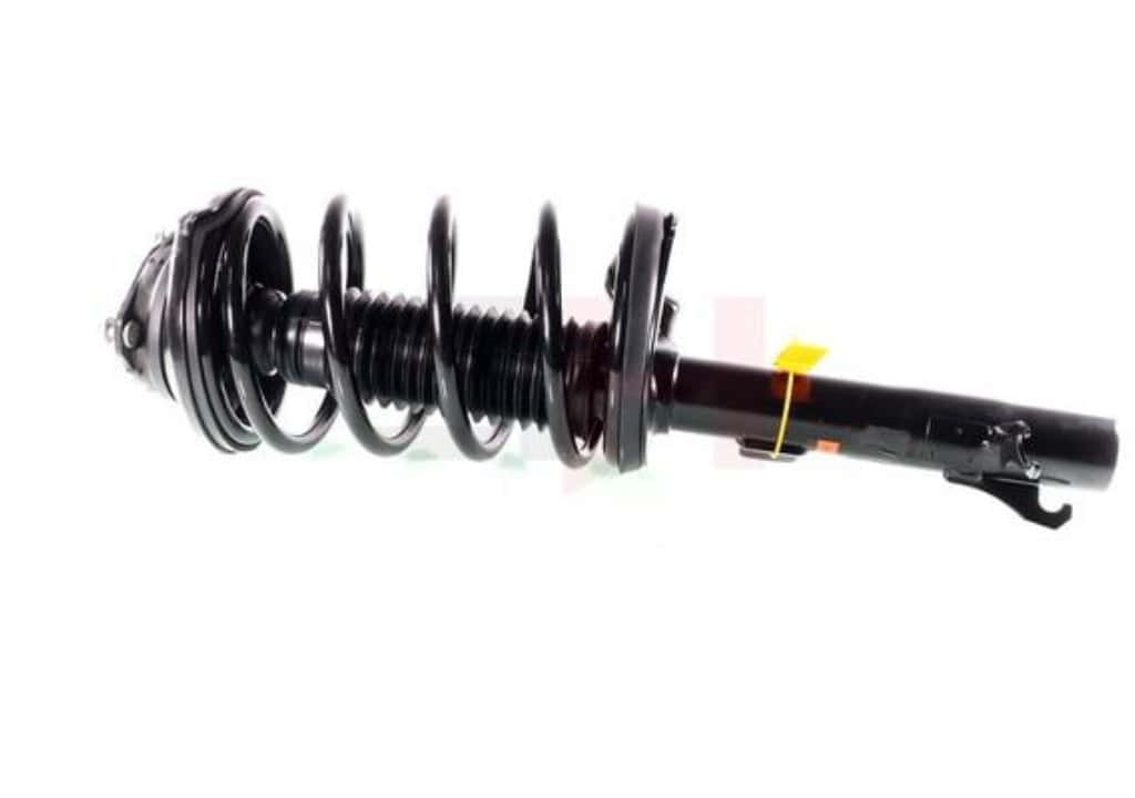 Hình chụp phuộc trước dạng strut gồm lò xo và giảm xóc trên xe ô tô.